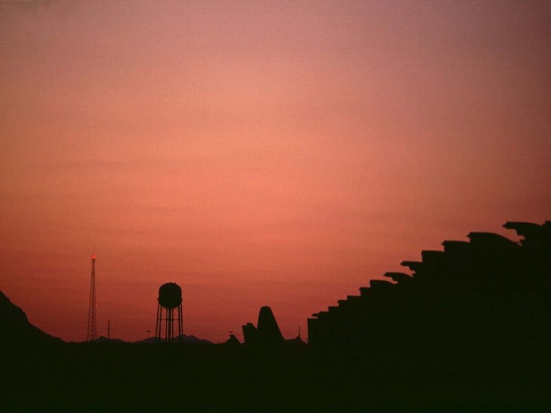 silhouette of water tower at sunset