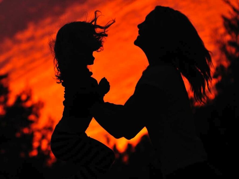 Silhouette of Woman and Child — Orange, Dramatic