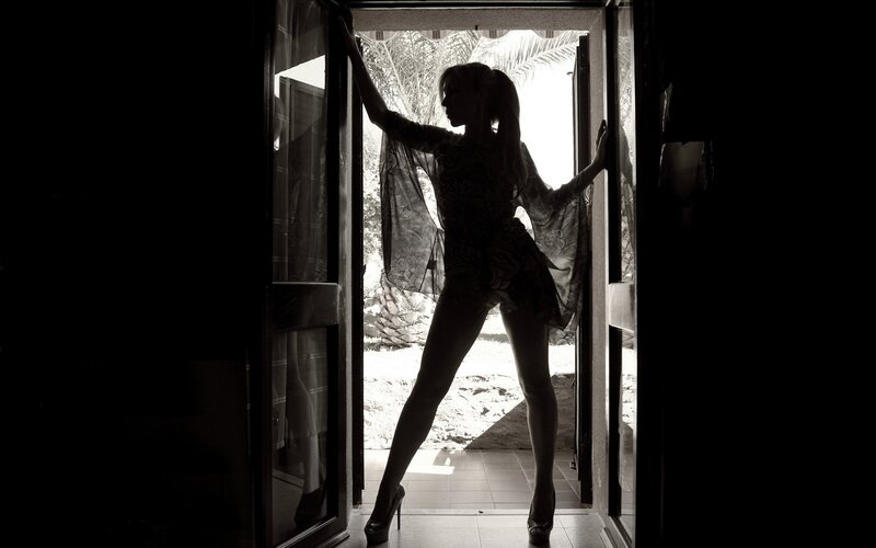 silhouette of woman at doorway