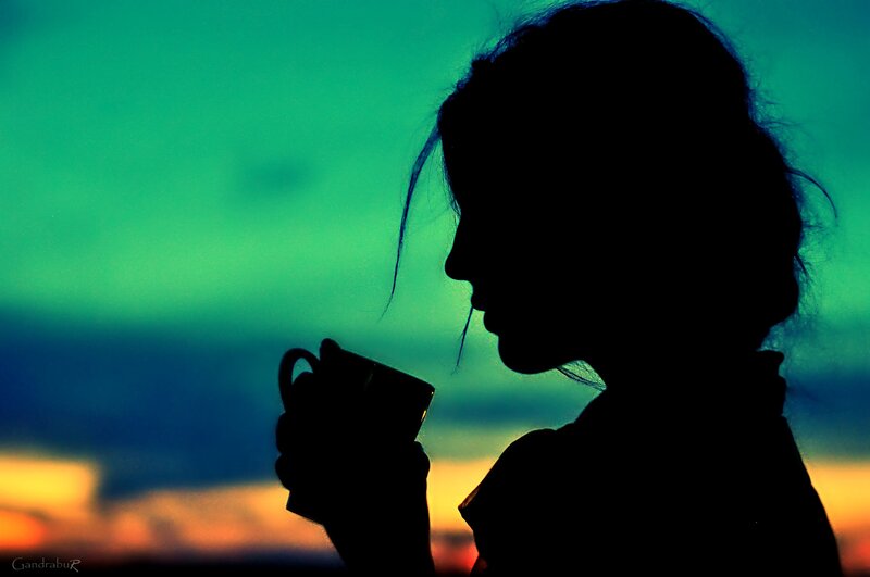 Silhouette of Woman Drinking