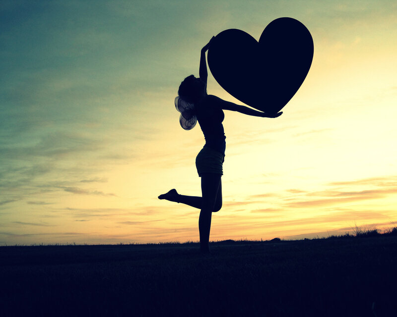 Silhouette of Woman Holding Heart — Yellow