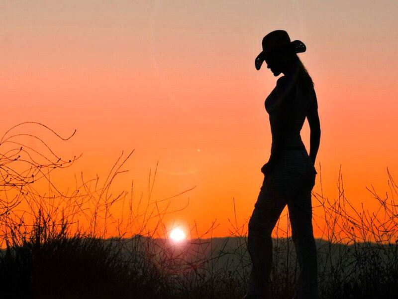 Silhouette of Woman in Cowboy Hat — Orange