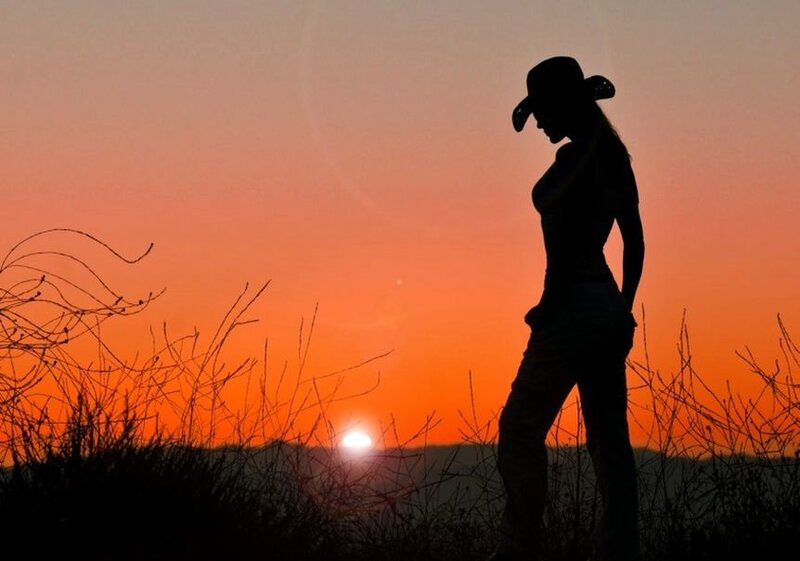 Silhouette of Woman in Cowboy Hat