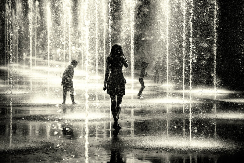 Silhouette of Woman in Fountain