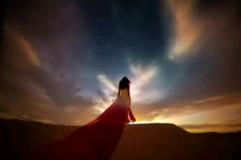 Silhouette of Woman in Red Dress