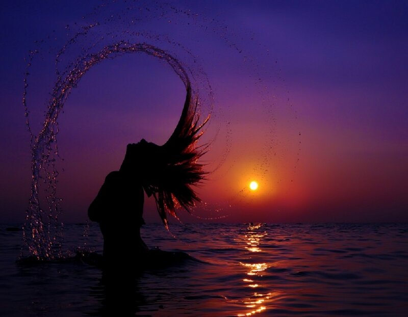 silhouette of woman in water