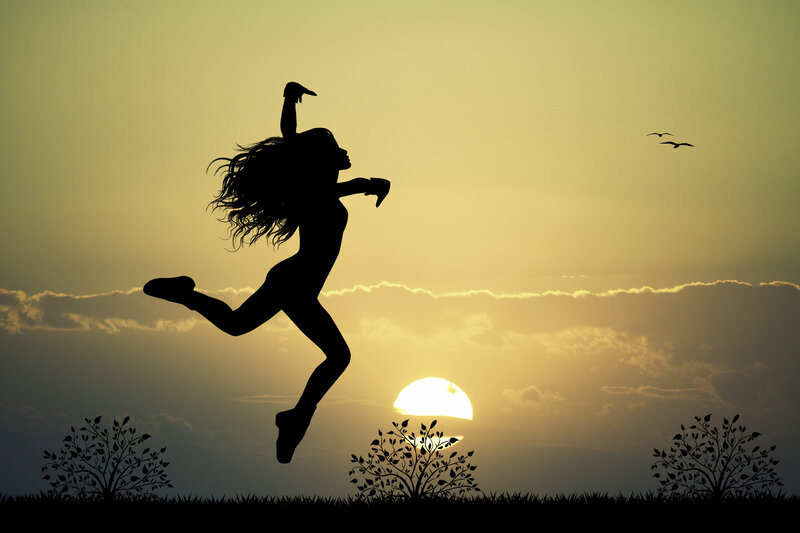 Silhouette of Woman Jumping — Yellow, Dramatic