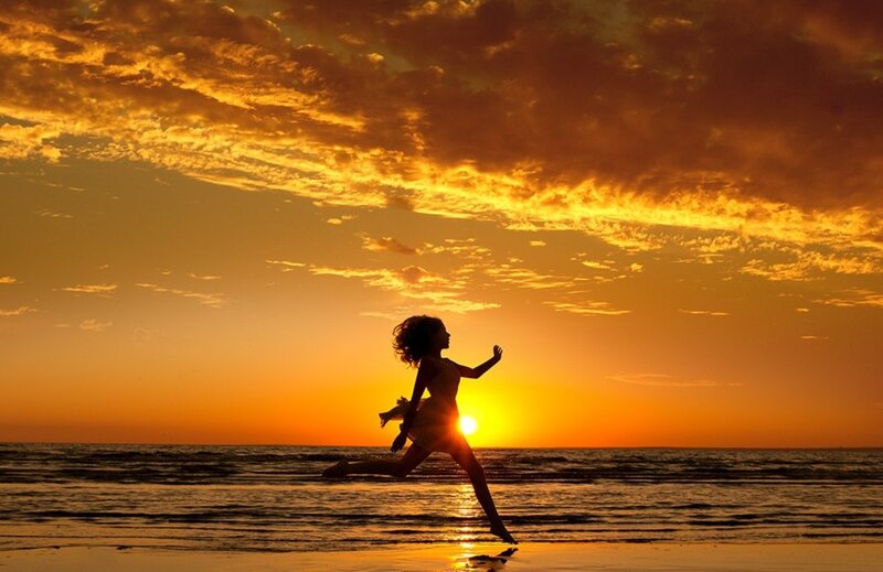 Silhouette of Woman Running — Orange, Dramatic
