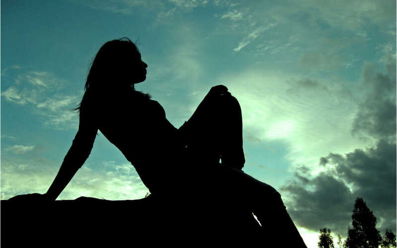 Silhouette of Woman Sitting — Blue, Dramatic