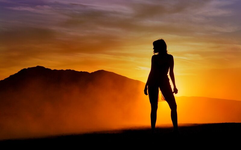 Silhouette of Woman Standing — Orange, Dramatic