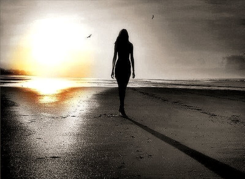 Silhouette of Woman Walking — Black, Dramatic, Sunset