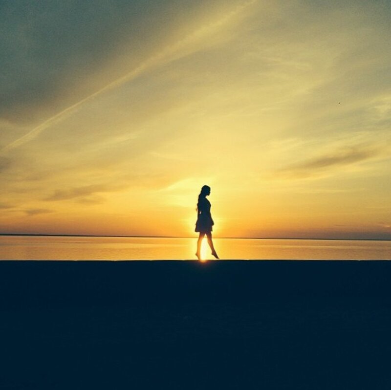 Silhouette of Woman Walking — Yellow, Serene