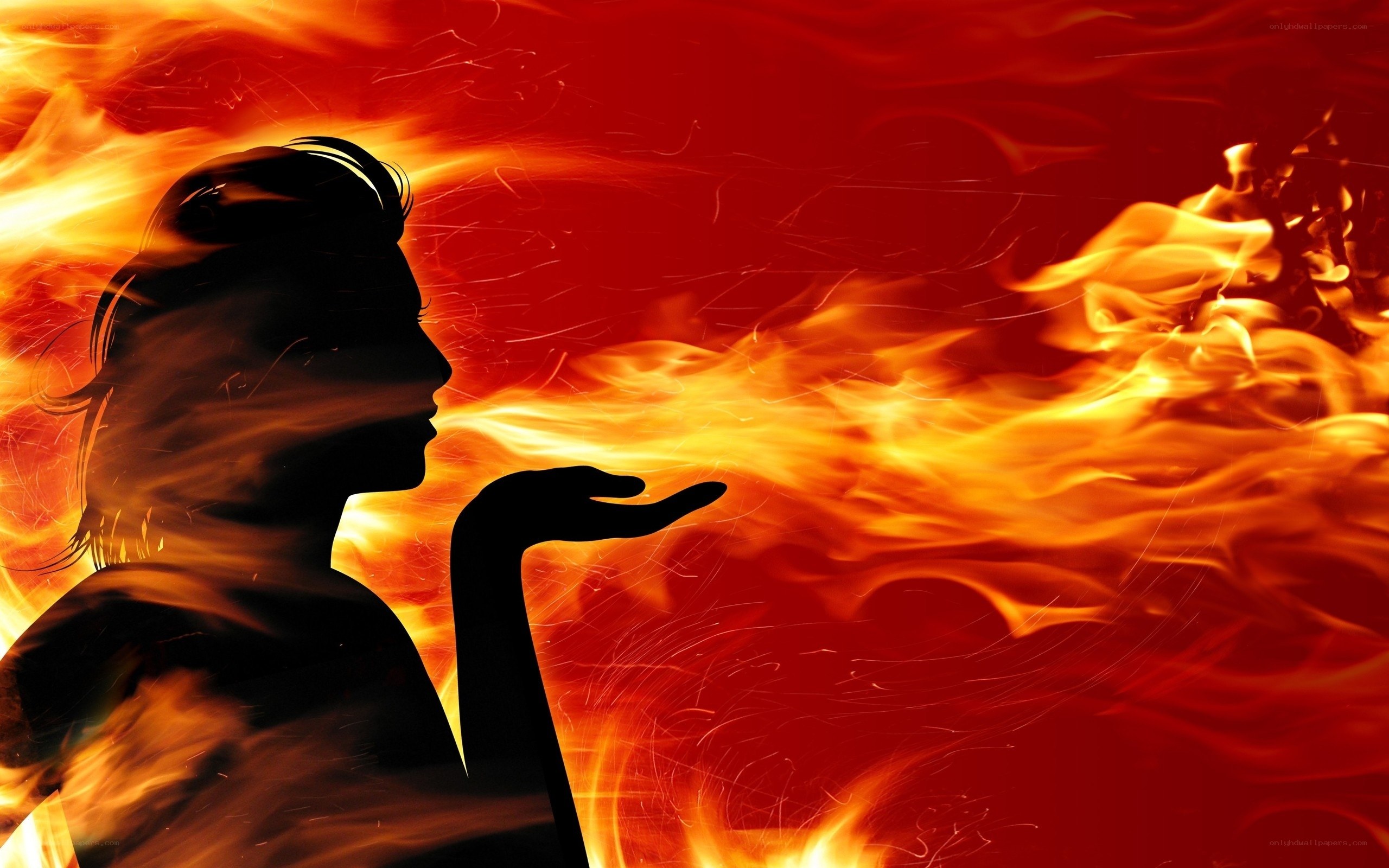 silhouette of woman with fire