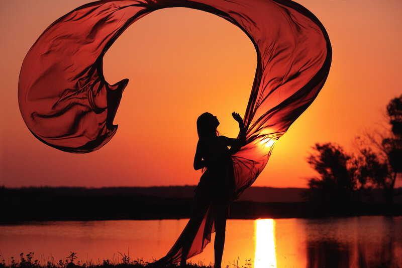 Silhouette of Woman with Scarf — Orange