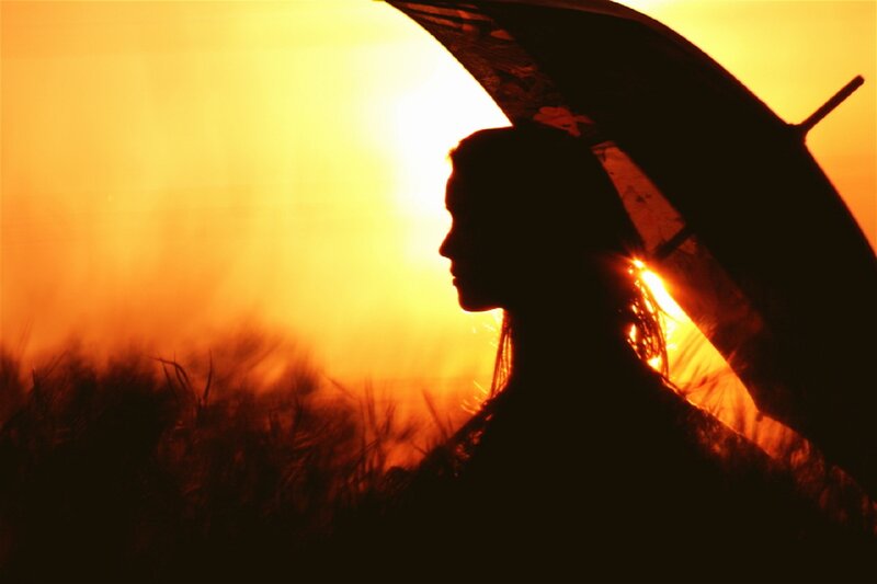 Silhouette of Woman with Umbrella — Orange