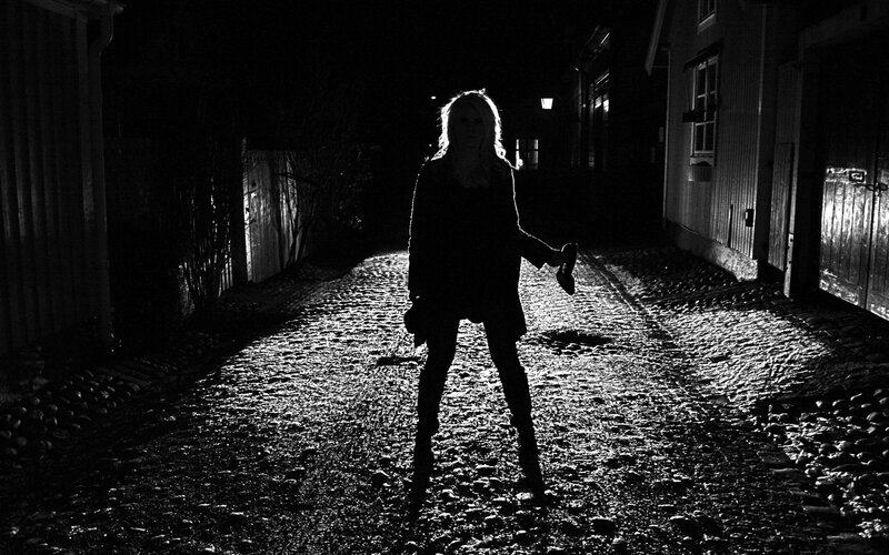 Silhouette on a cobblestone alley