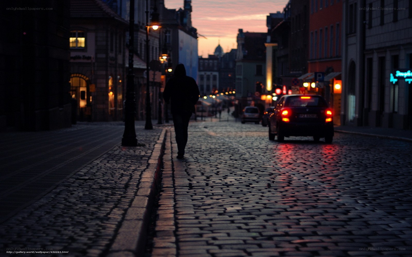 Silhouette on a cobblestone street