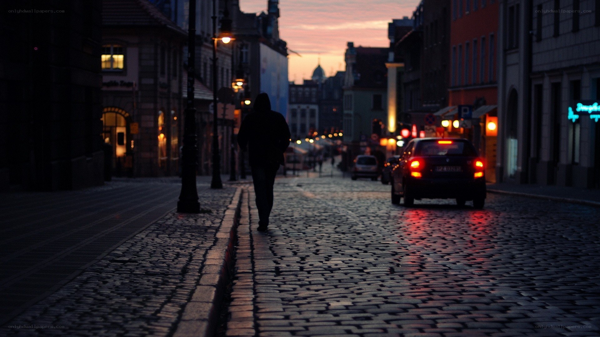 Silhouette on a cobblestone street