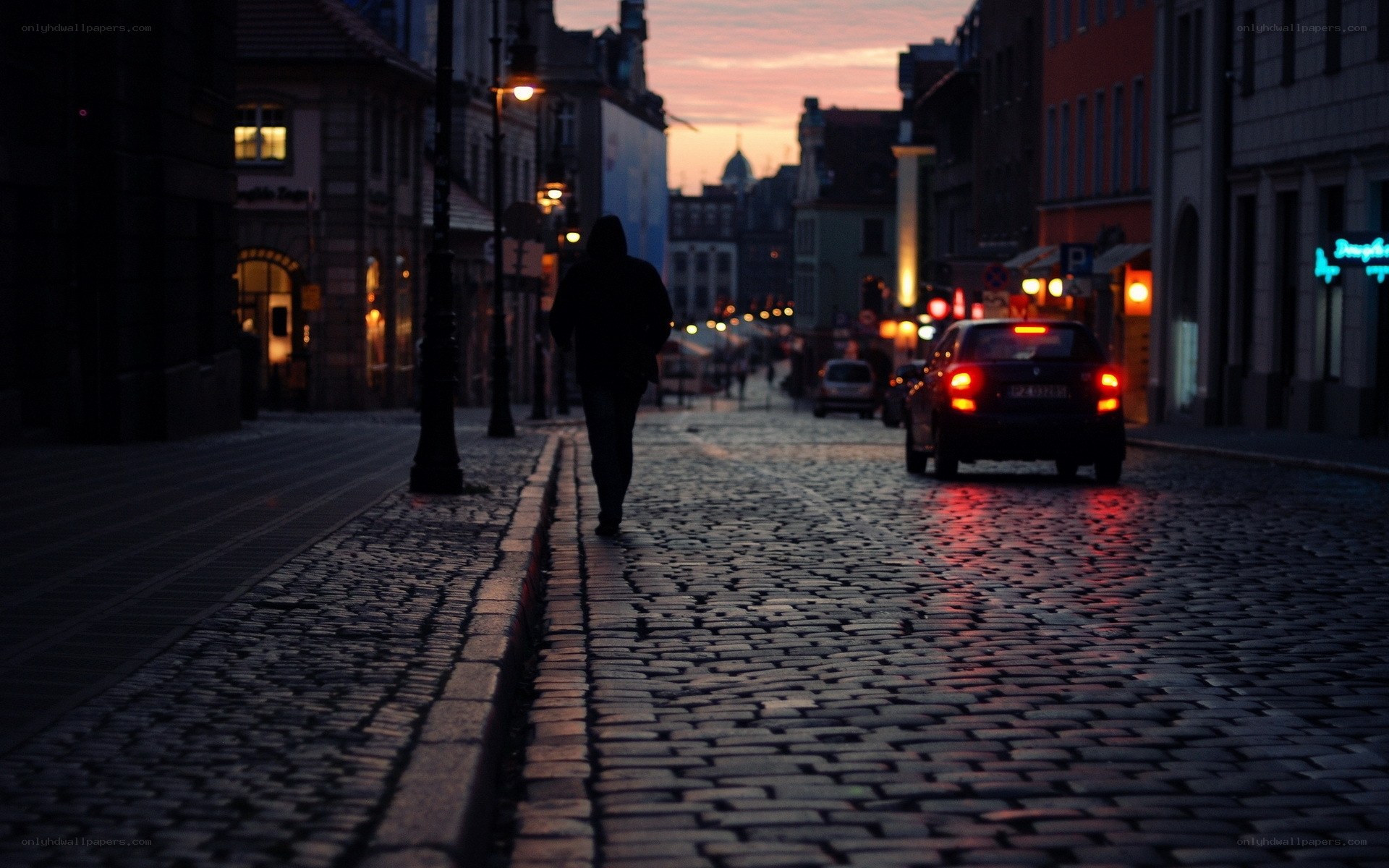 Silhouette on a cobblestone street