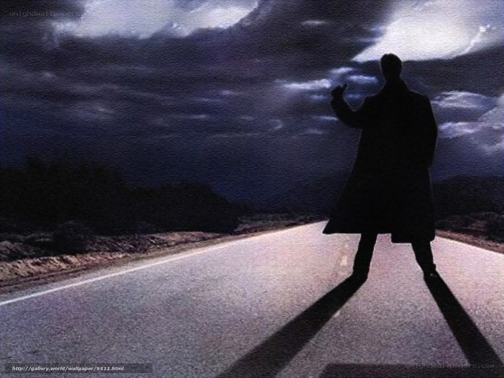 silhouette on a dark road