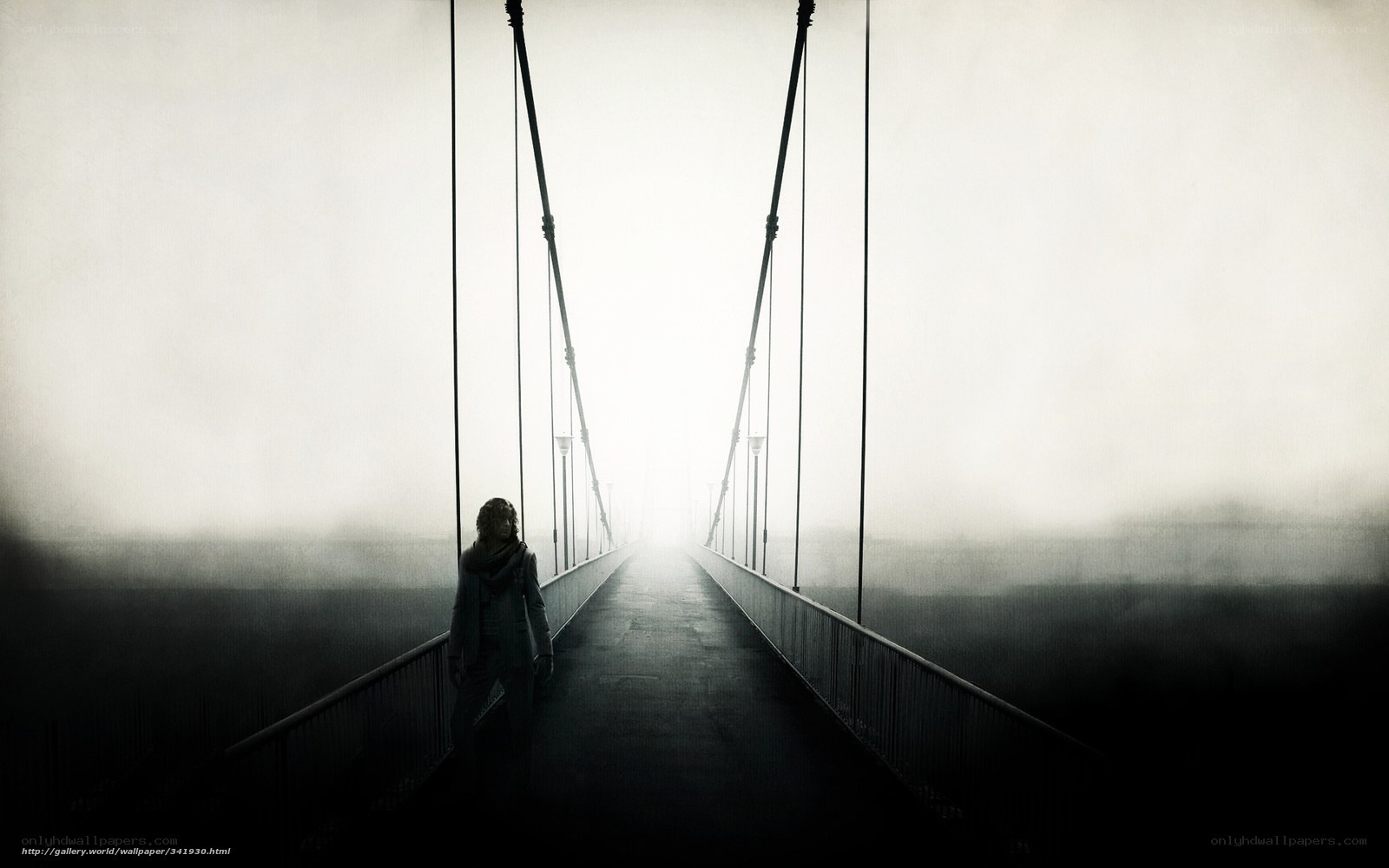 Silhouette on a foggy bridge