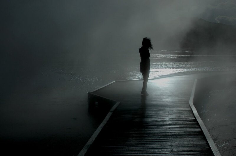 Silhouette on a foggy pier