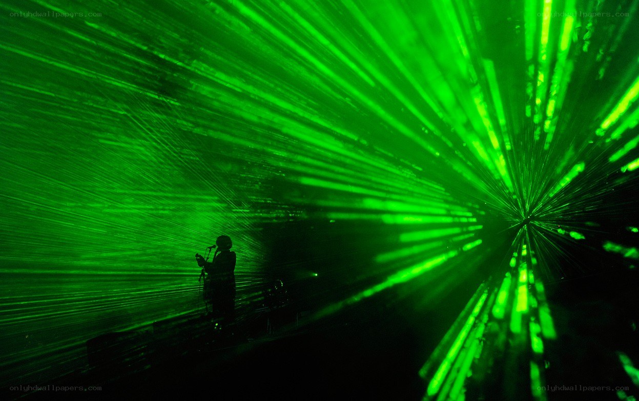 Silhouette on a green-lit stage