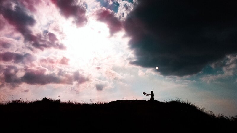 Silhouette on a hill at sunset