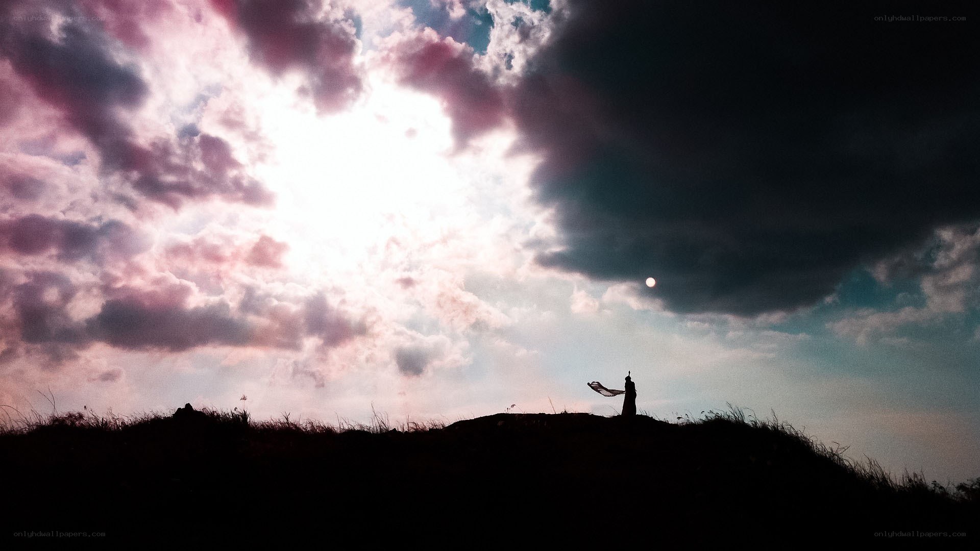 Silhouette on a hill at sunset