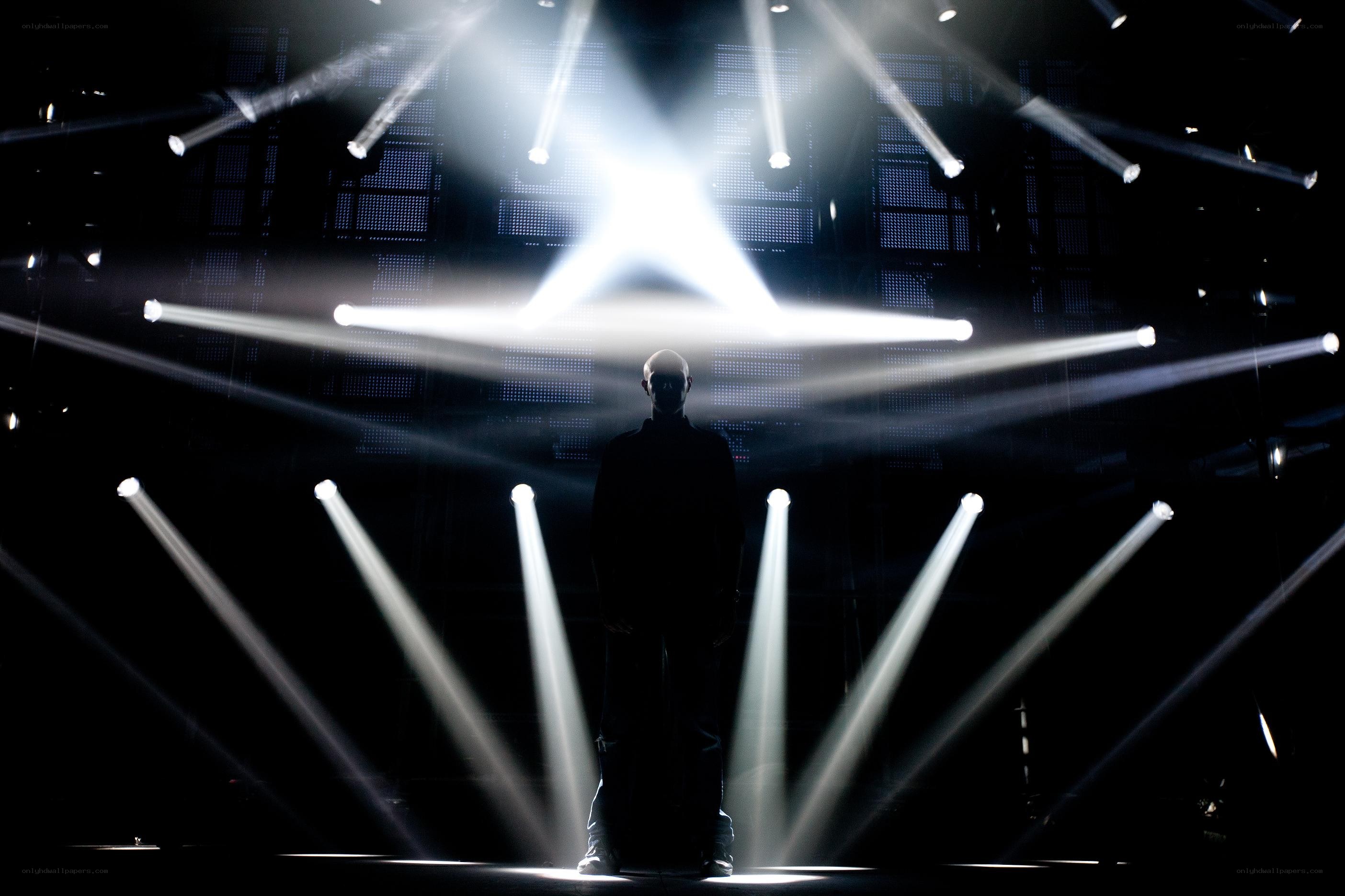 silhouette on a lit stage