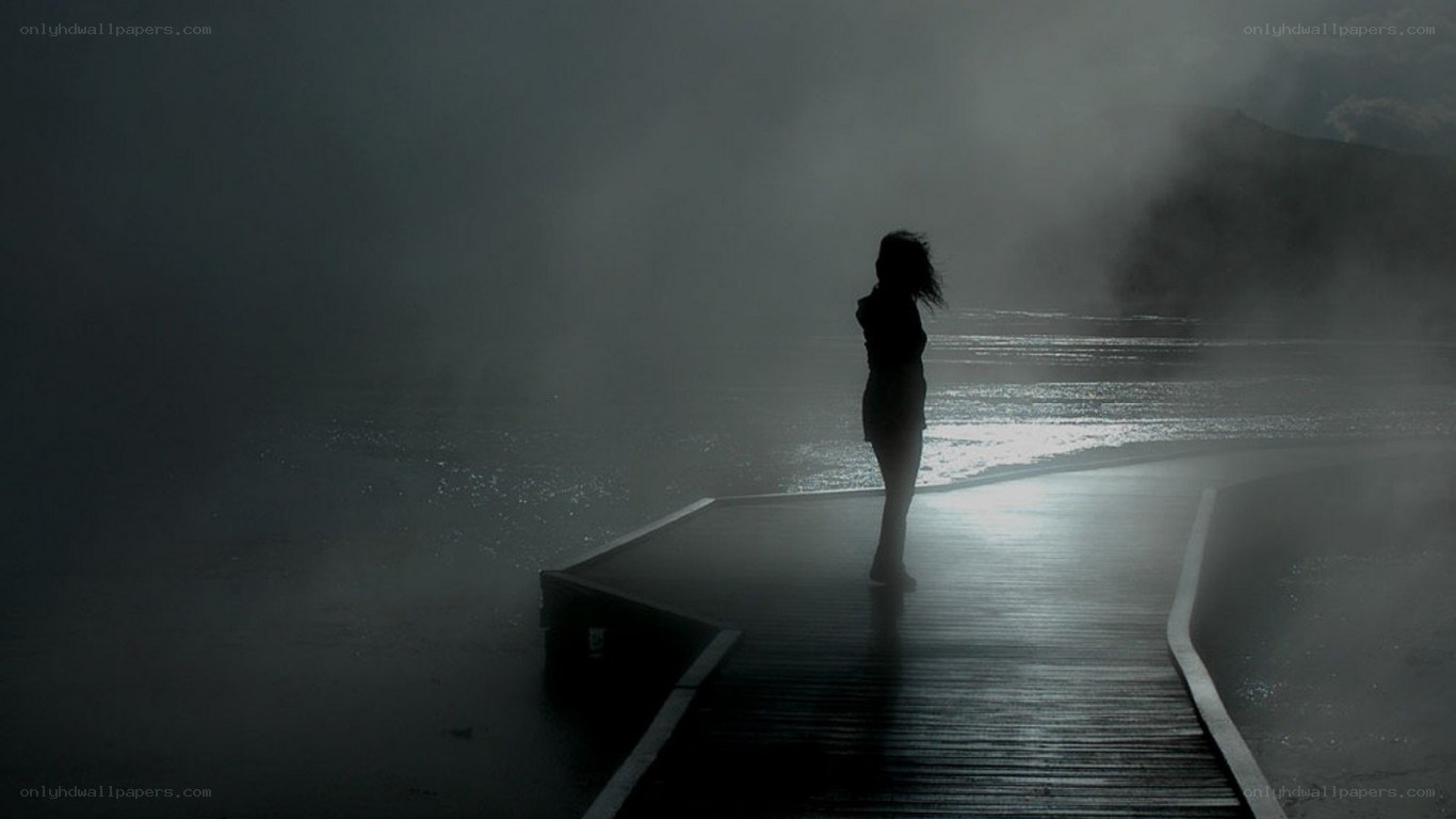 silhouette on a misty pier