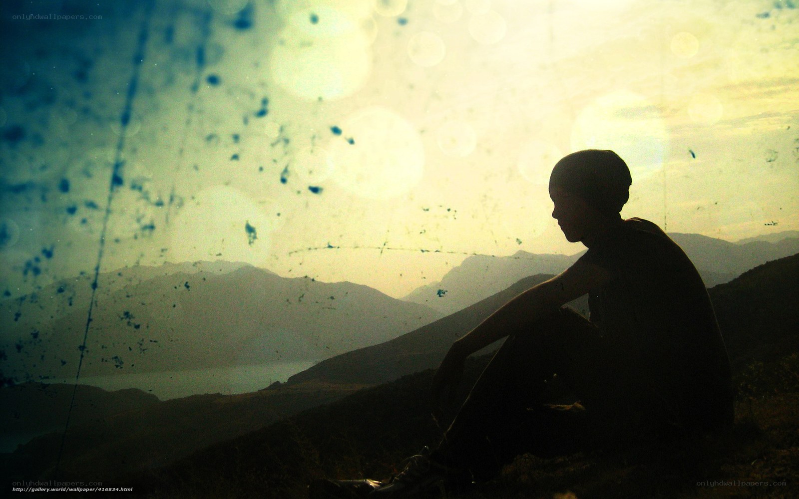 Silhouette on a mountain at sunset