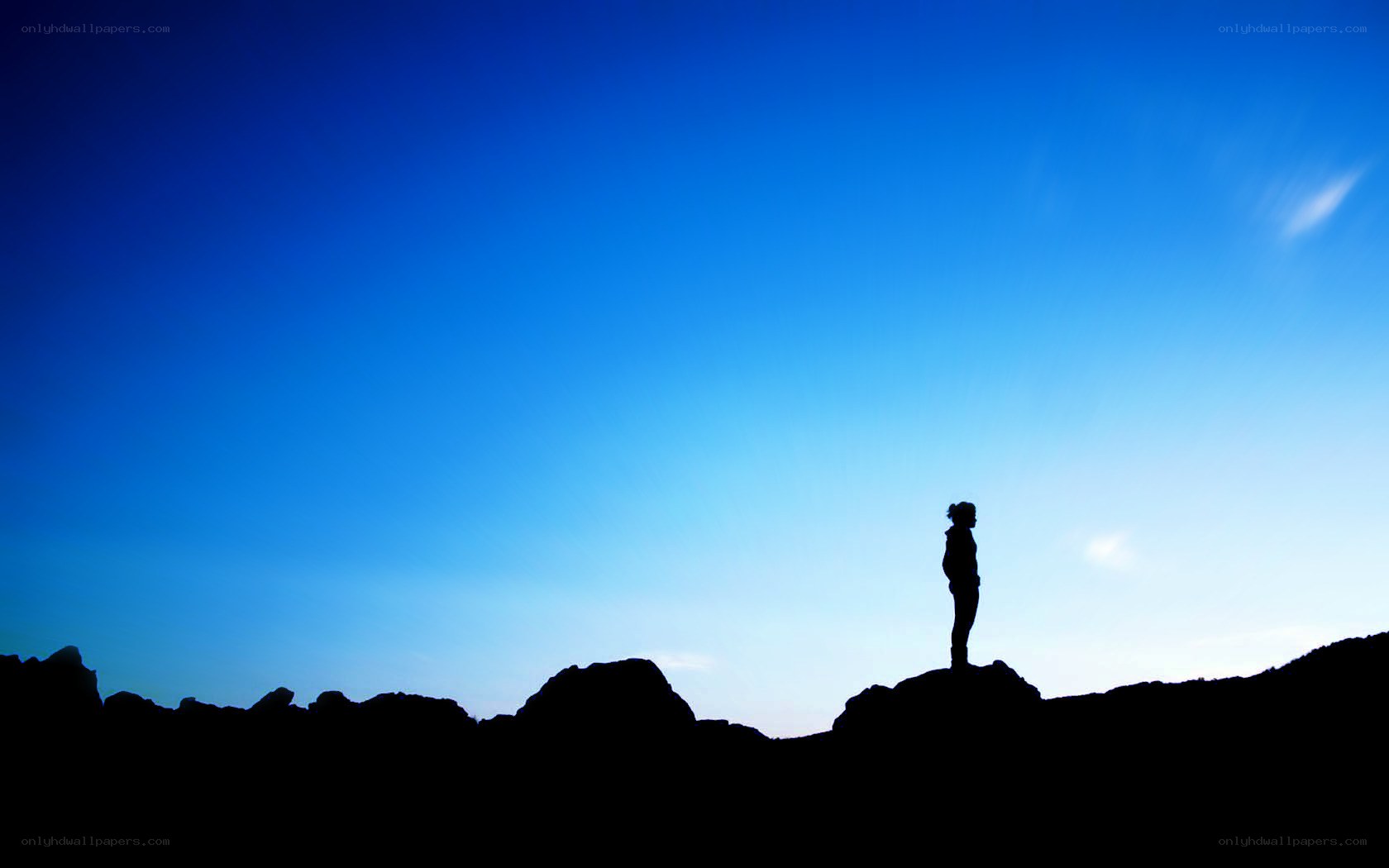 Silhouette on a rocky peak