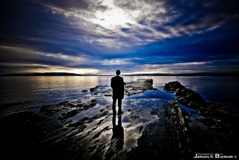Silhouette on a rocky shore
