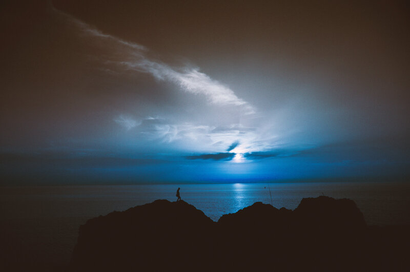 Silhouette on a rocky shore