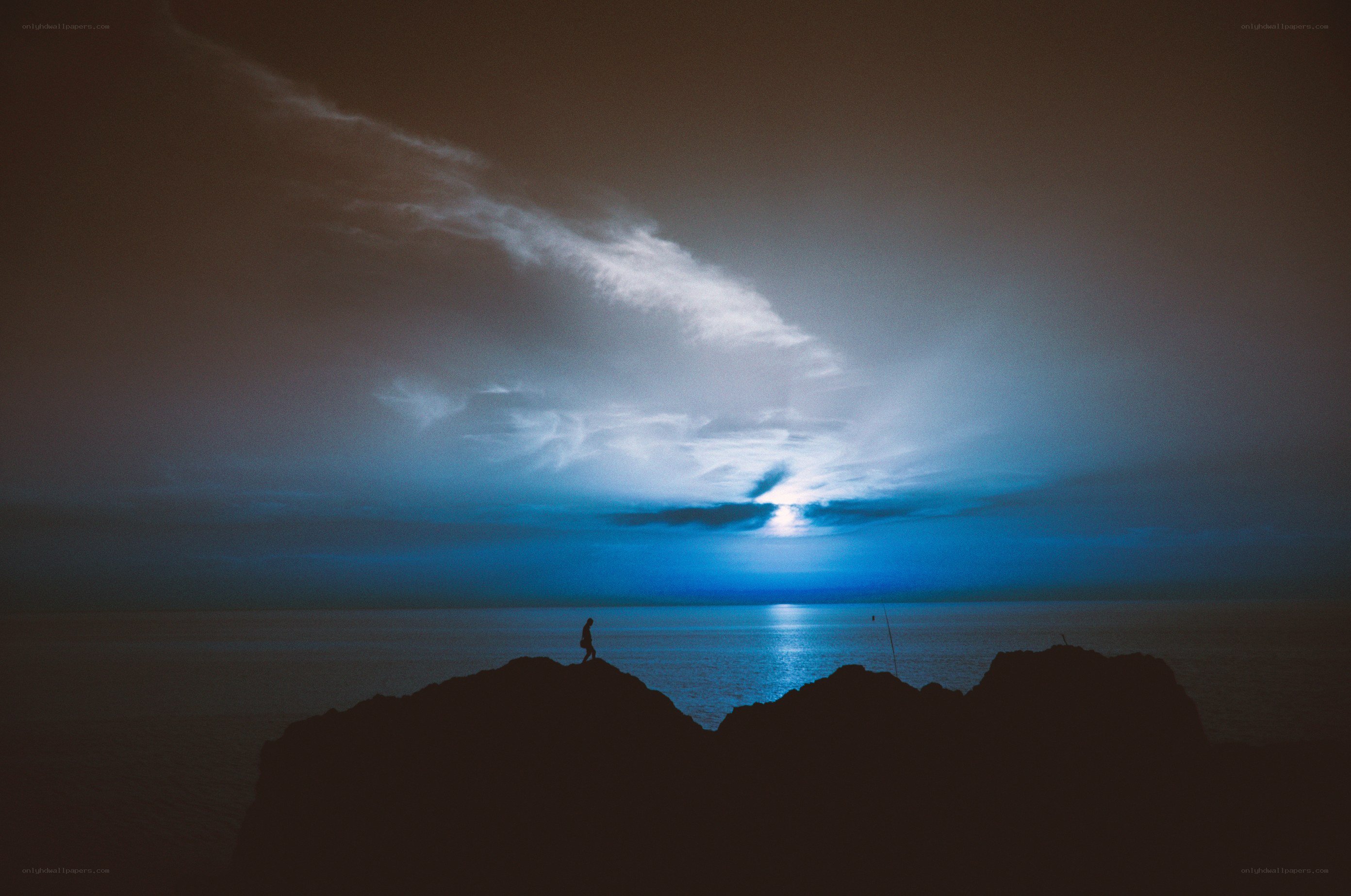 Silhouette on a rocky shore