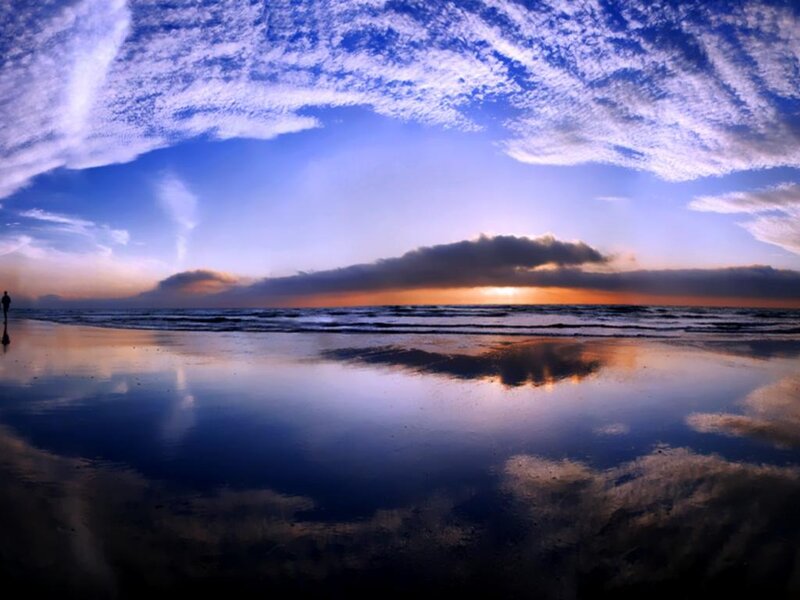 Silhouette on Beach at Sunset — Blue