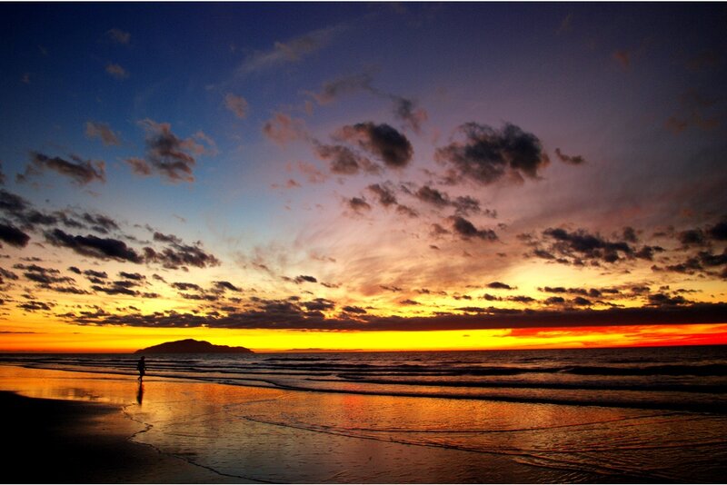 Silhouette on Beach at Sunset — Orange