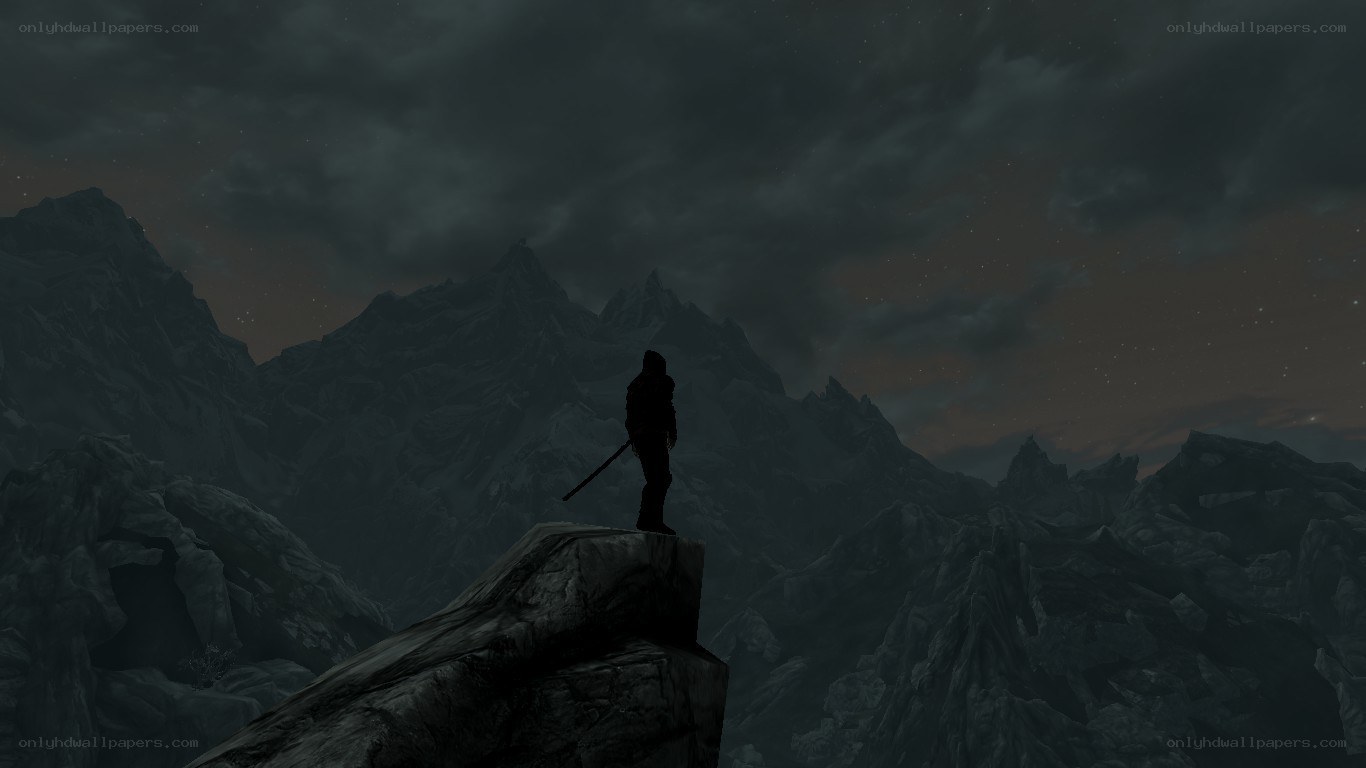 silhouette on mountain peak