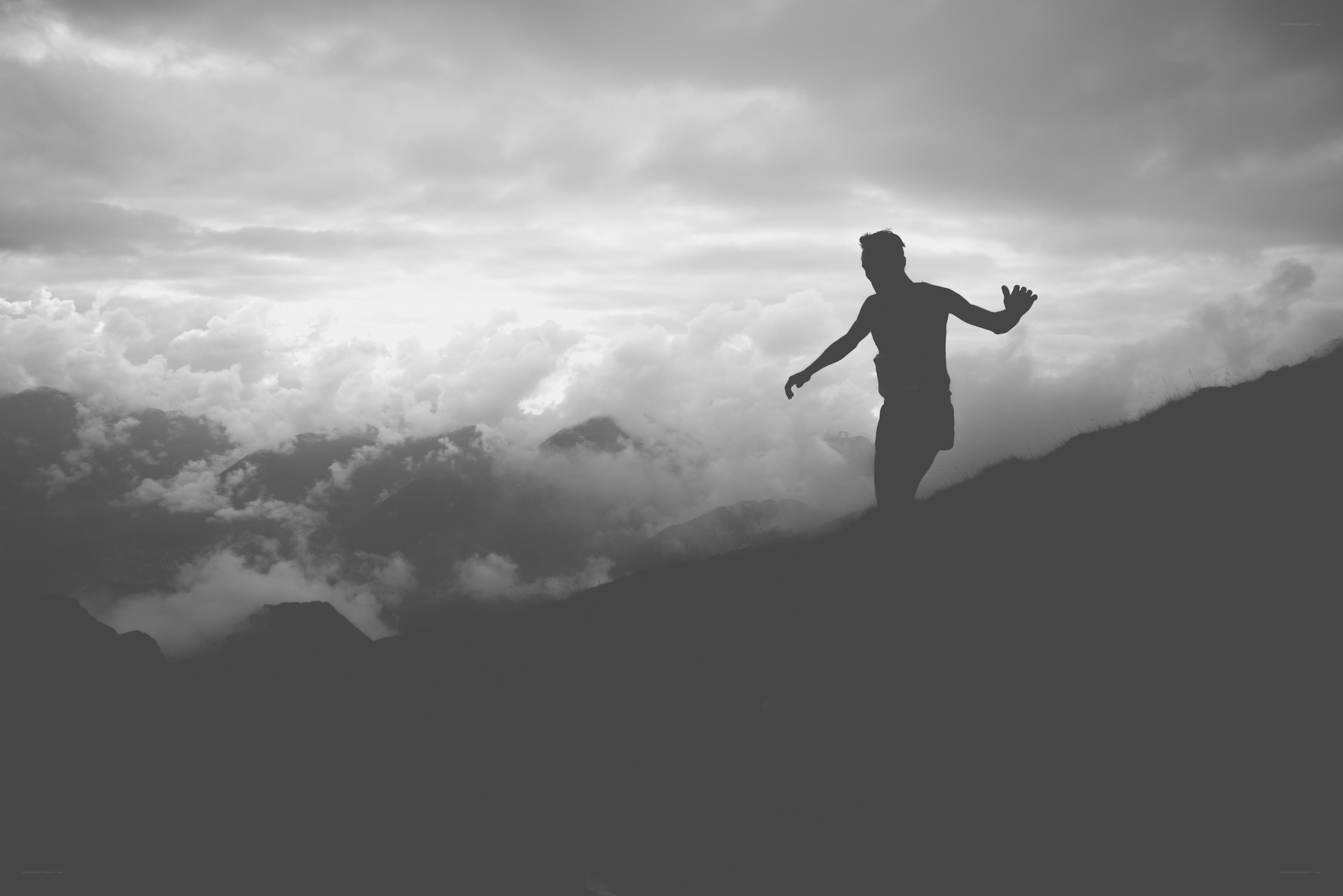 silhouette on mountain peak
