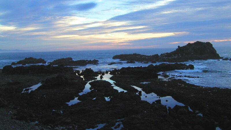 Silhouette on Rocky Shore — Blue