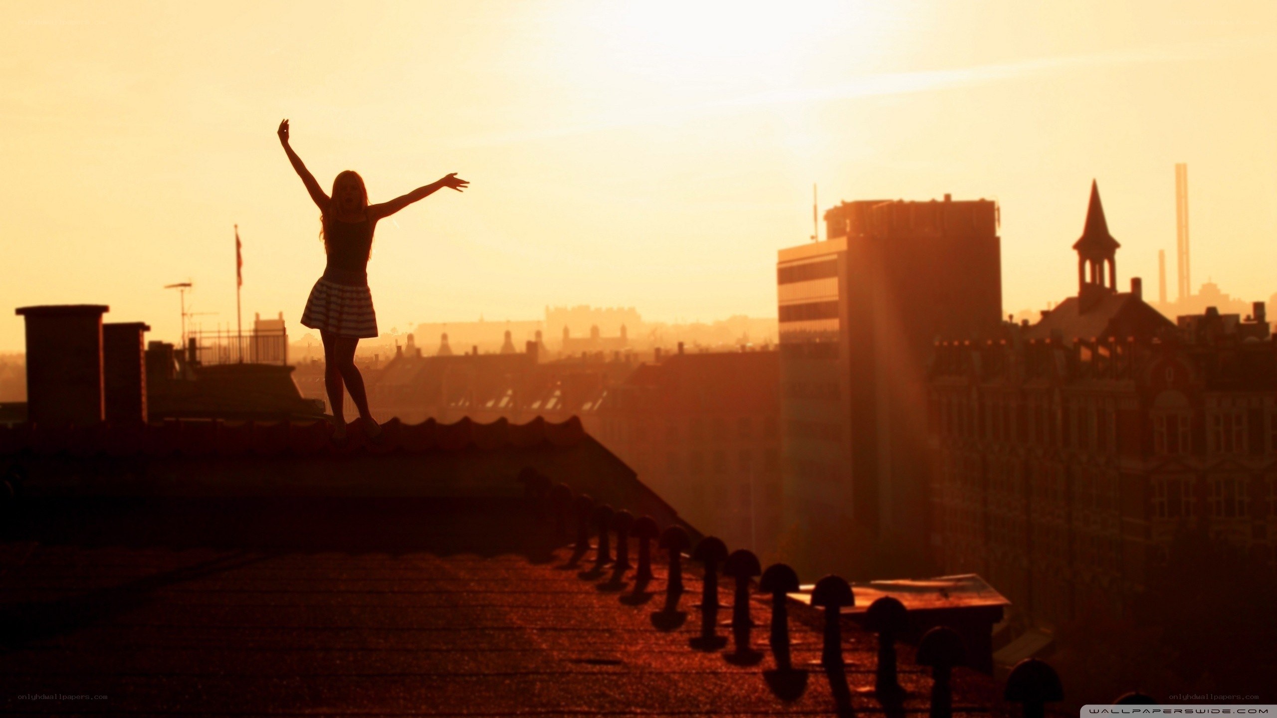 silhouette on rooftop at sunset