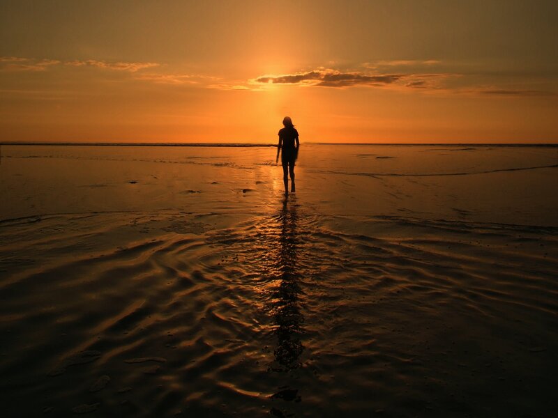 Silhouette on the beach at sunset