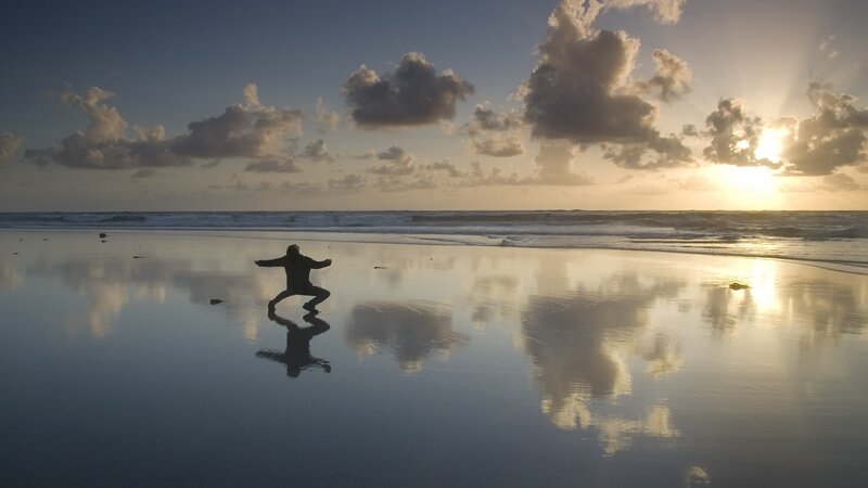 Silhouette on the beach at sunset