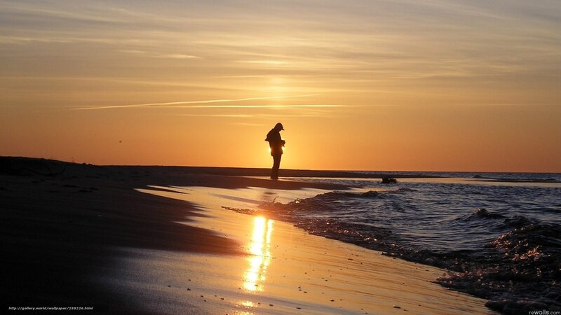 Silhouette on the beach at sunset