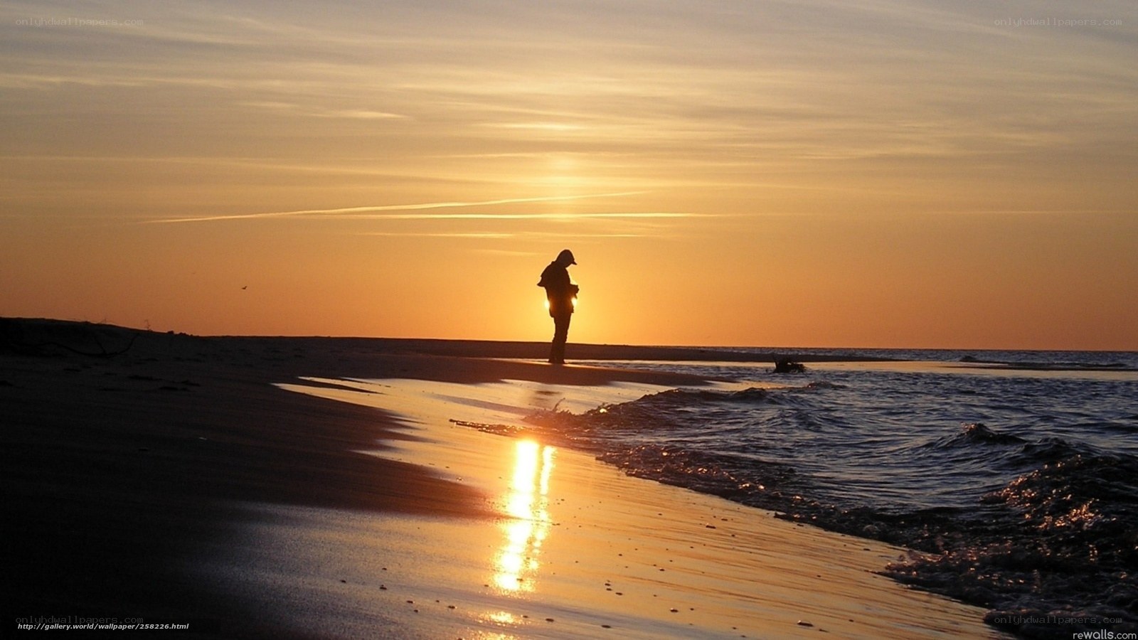 Silhouette on the beach at sunset