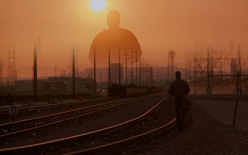 silhouette on train tracks