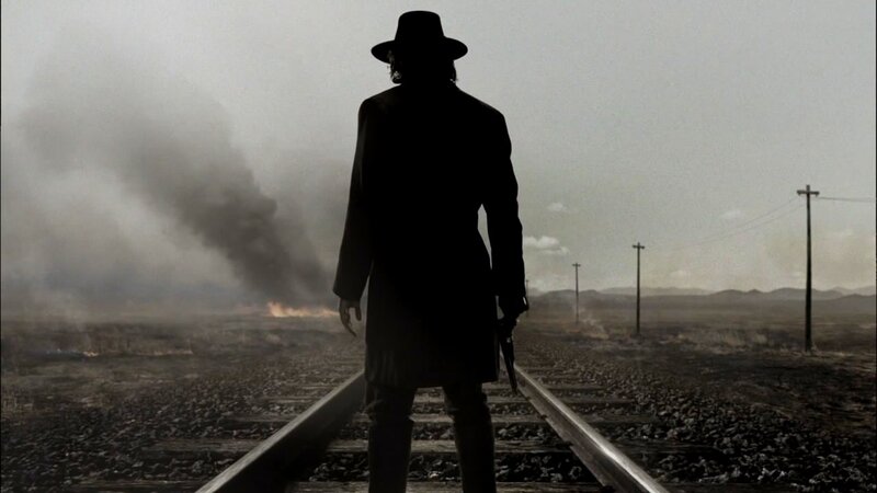 silhouette on train tracks