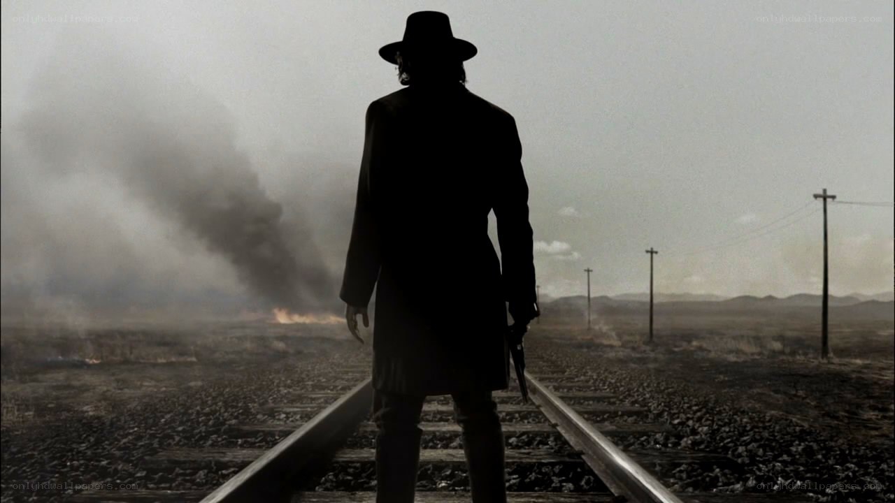 silhouette on train tracks
