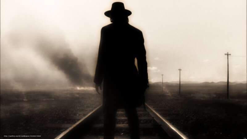 silhouette on train tracks